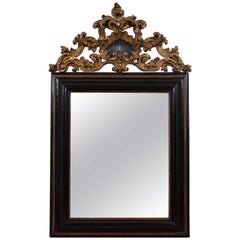 Italian Baroque Ebonized 
Carved Giltwood Wall Mirror, Late 17th Century
