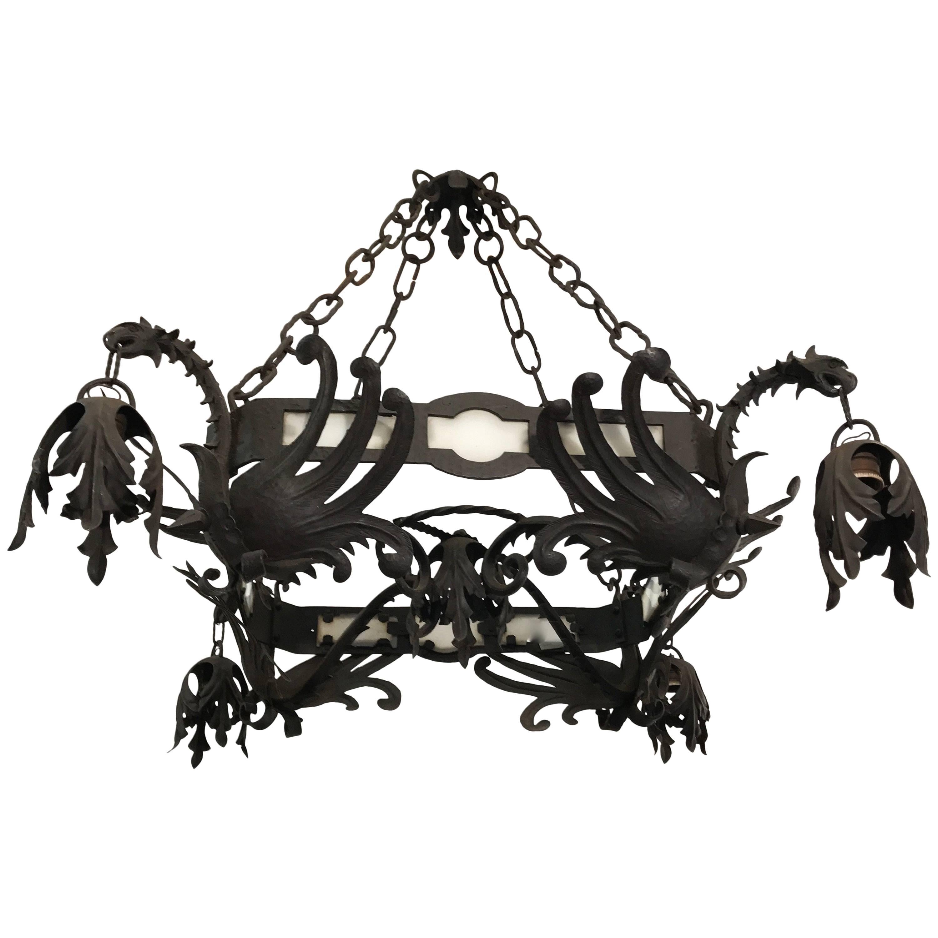 Unique Hand Forged Wrought Iron Chandelier with Four Winged Griffin Sculptures For Sale