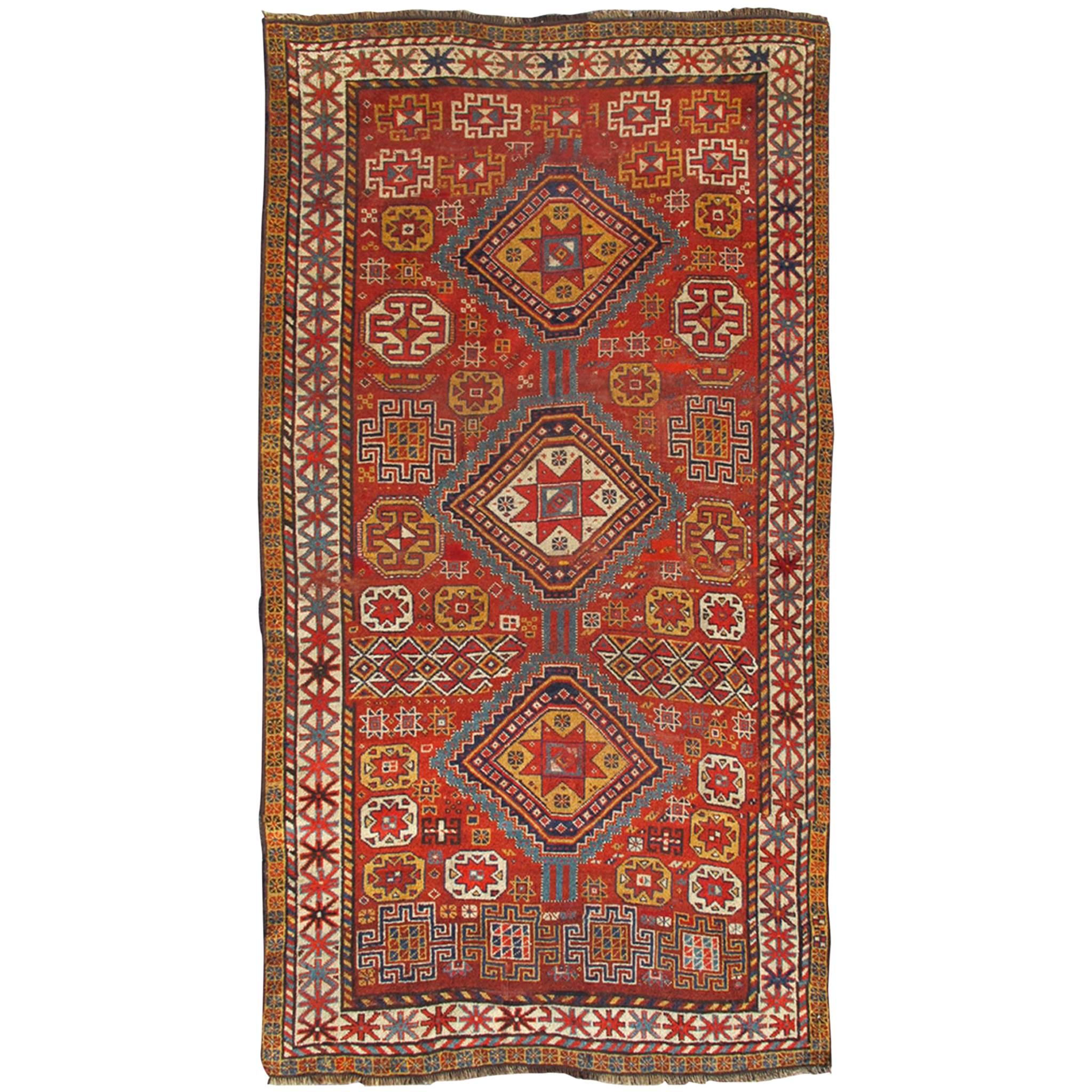 Unique Antique Qashqai Rug with Geometric Motifs in Red, Blue, and Golden Yellow
