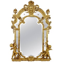 French 19th Century Louis XV Style Giltwood and Gesso Carved Mirror with Cherubs