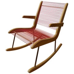 Modernist String Wood and Iron Rocking Chair by Carl Koch