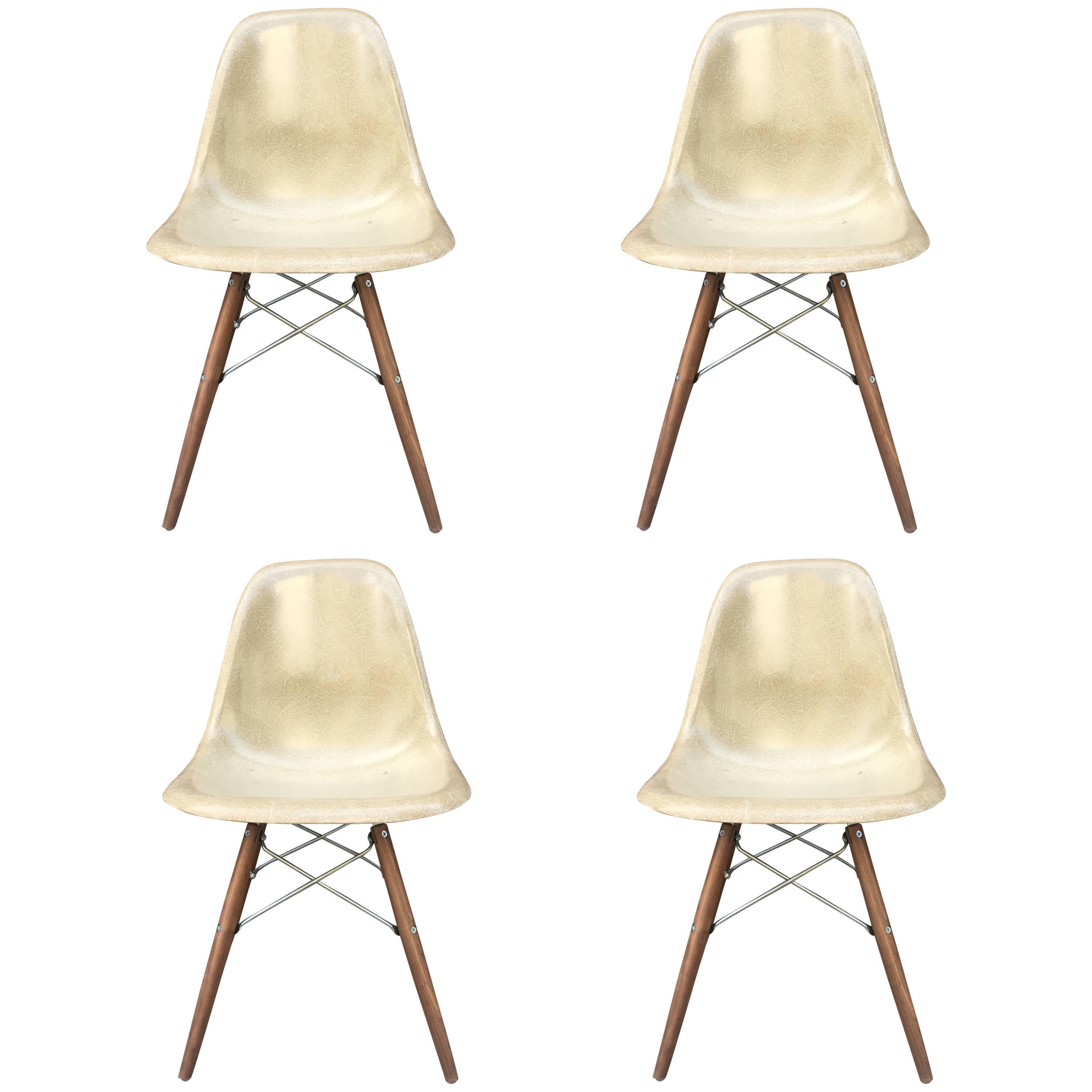 Four Tan Herman Miller Eames Dining Chairs