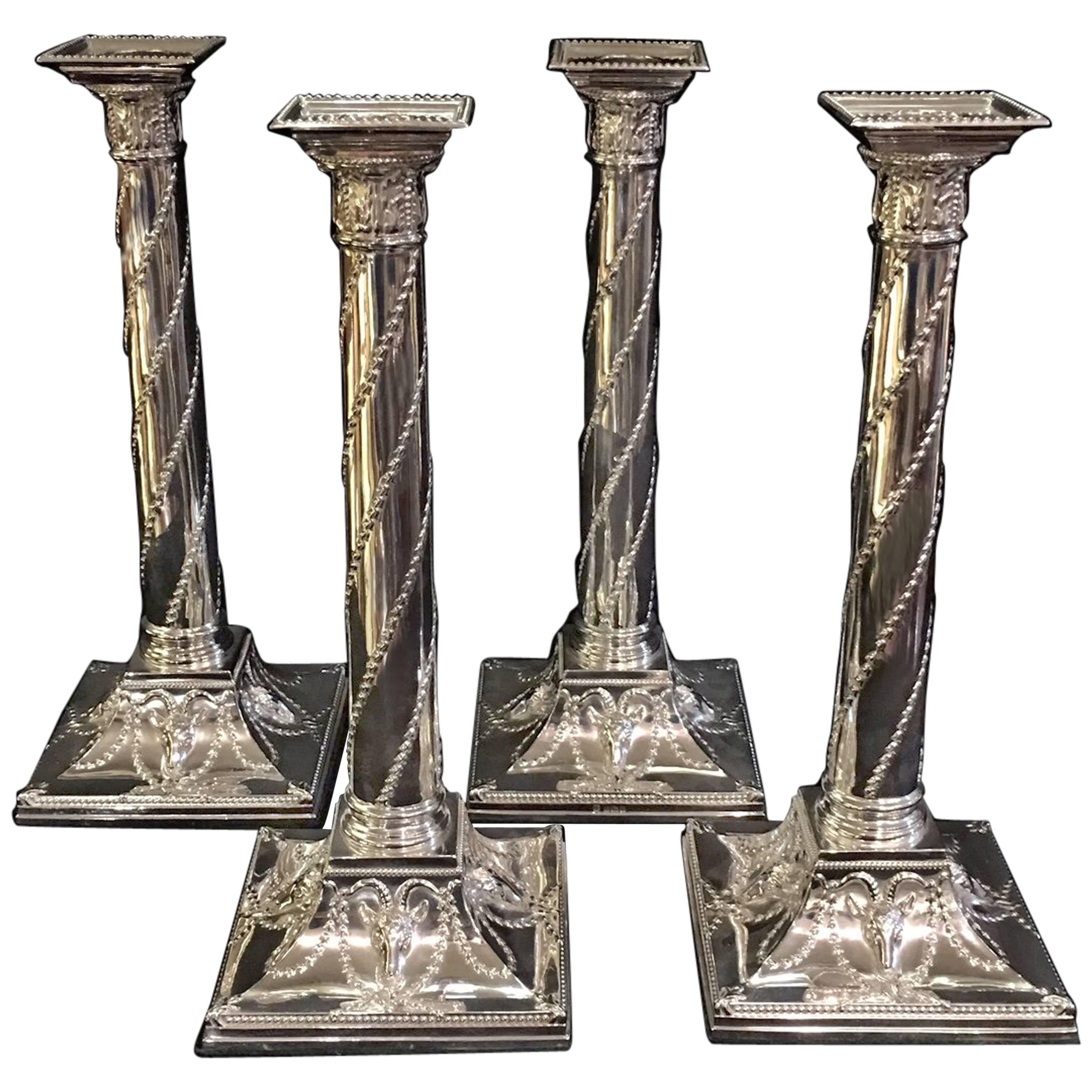 Fine Set of Four Adan Style Silver Candlesticks For Sale