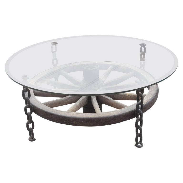 Turn Of The Century French Wagon Wheel, Glass Rustic Coffee Table With Wheels