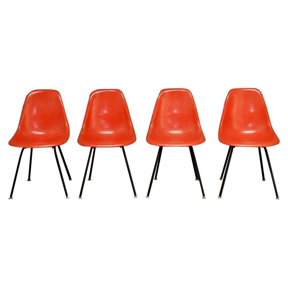 Set of Four Mid-Century Miller Eames Orange Fiberglass Shell Chairs