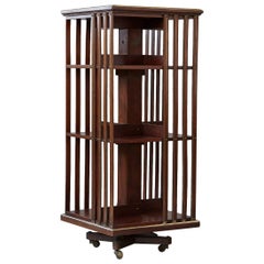 Antique French Revolving Mahogany Bookcase on Raised Casters with Brass Trim