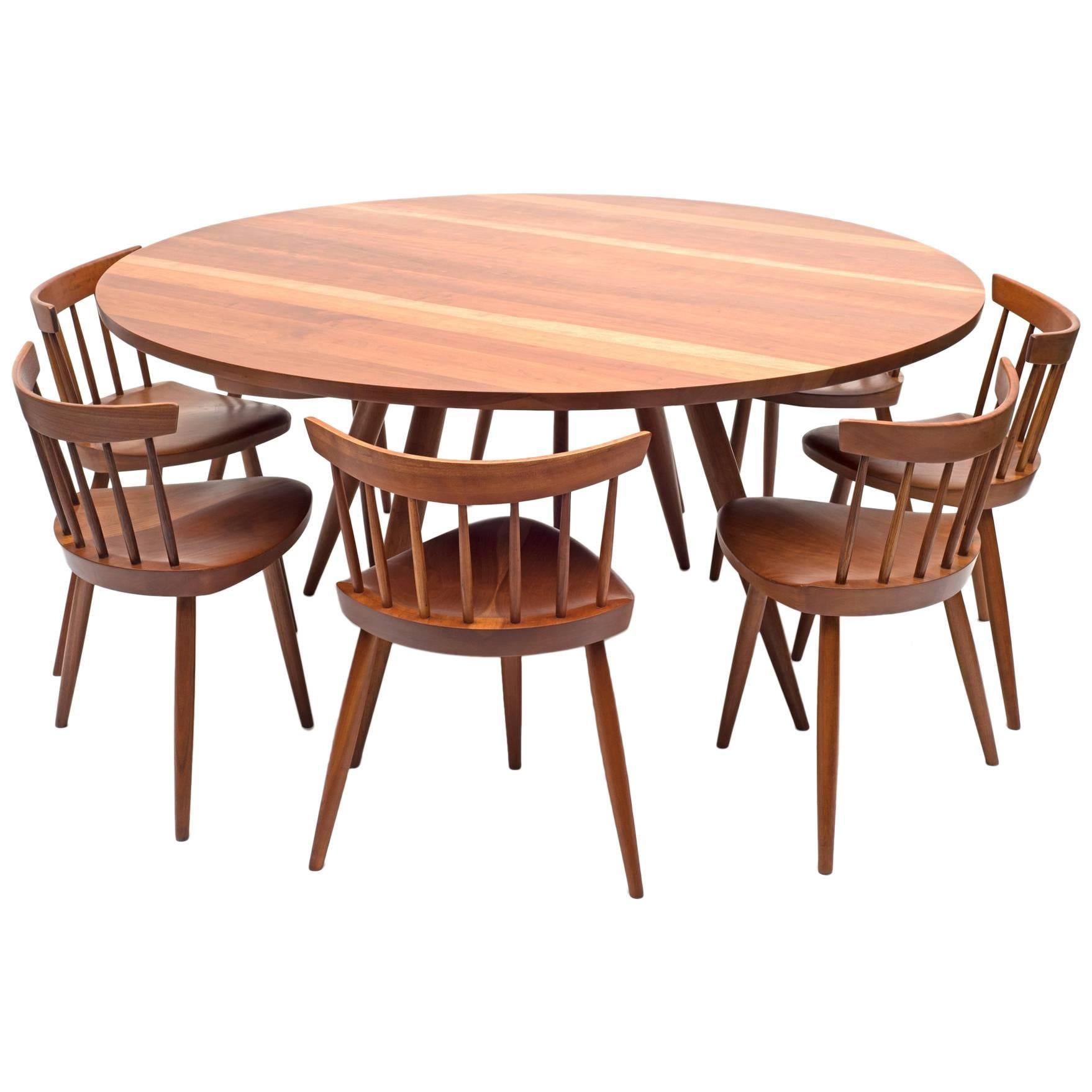 George Nakashima Round Cherry Dining Table and Nine Mira Chairs, USA, 1960s