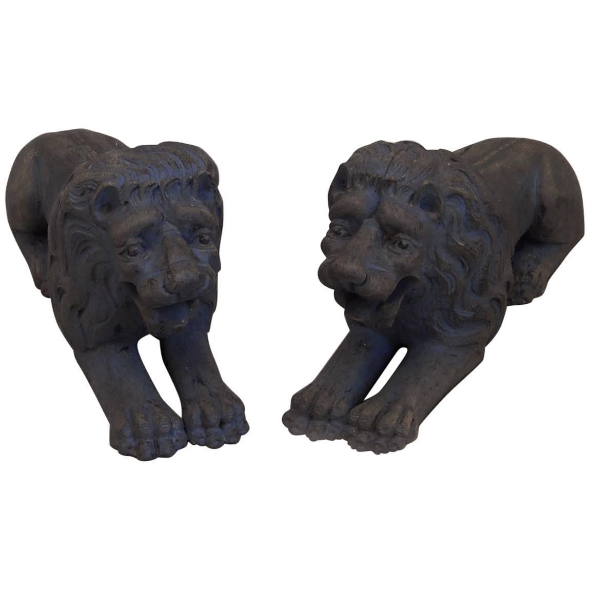 Pair of Carved Lions Couchant