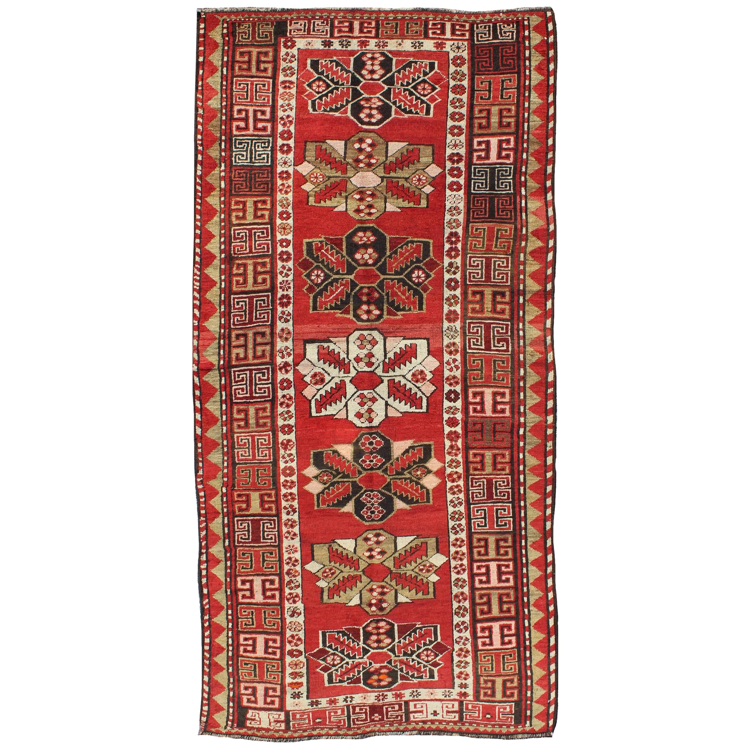 Antique Kazak Runner with Medallions and Tribal Design in Red Background  For Sale