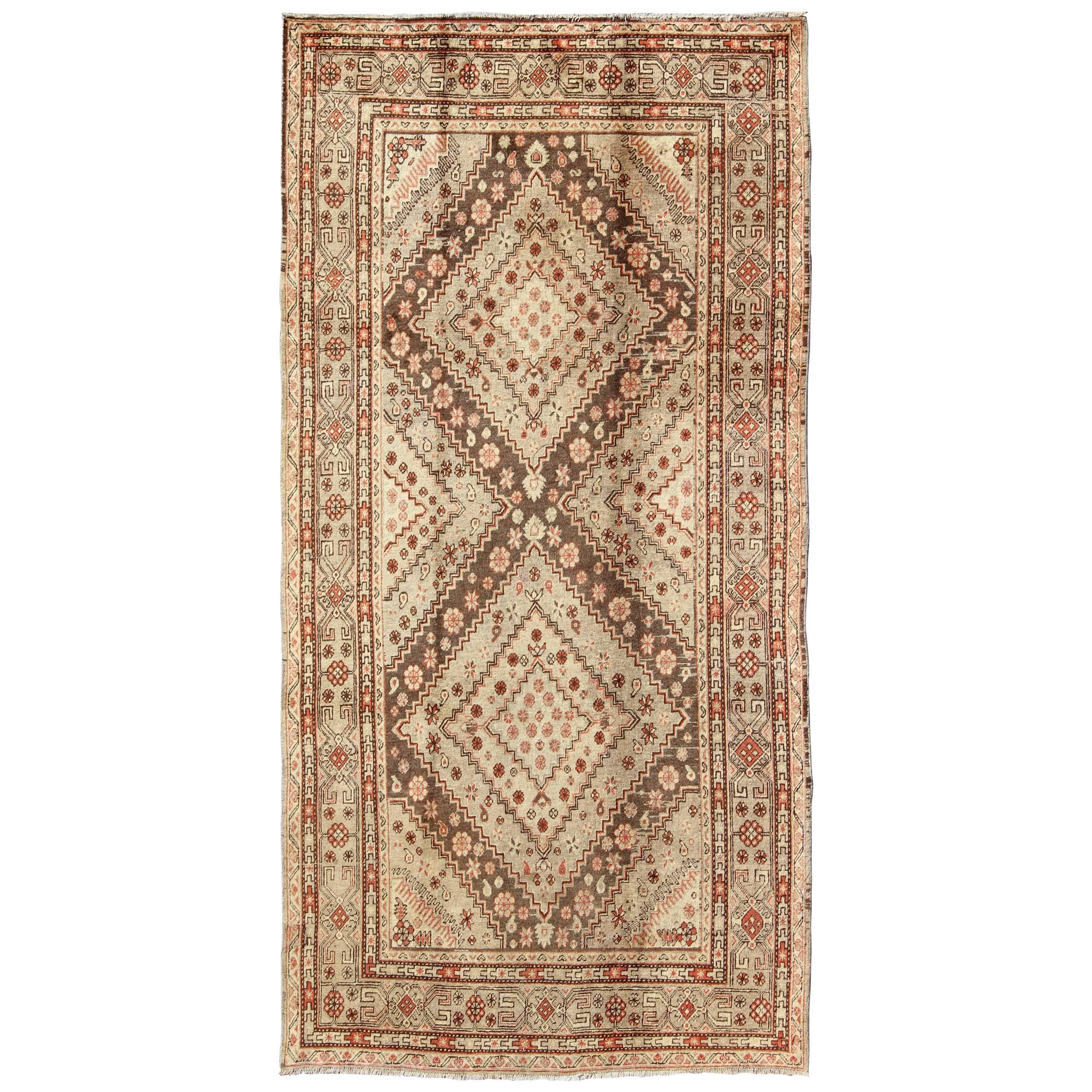 Early 20th Century Antique Khotan Rug with Paired Diamond Medallions in Brown For Sale