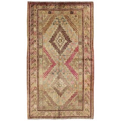 Early 20th Century Antique Khotan Rug with Paired Diamond Medallions in Wine Red