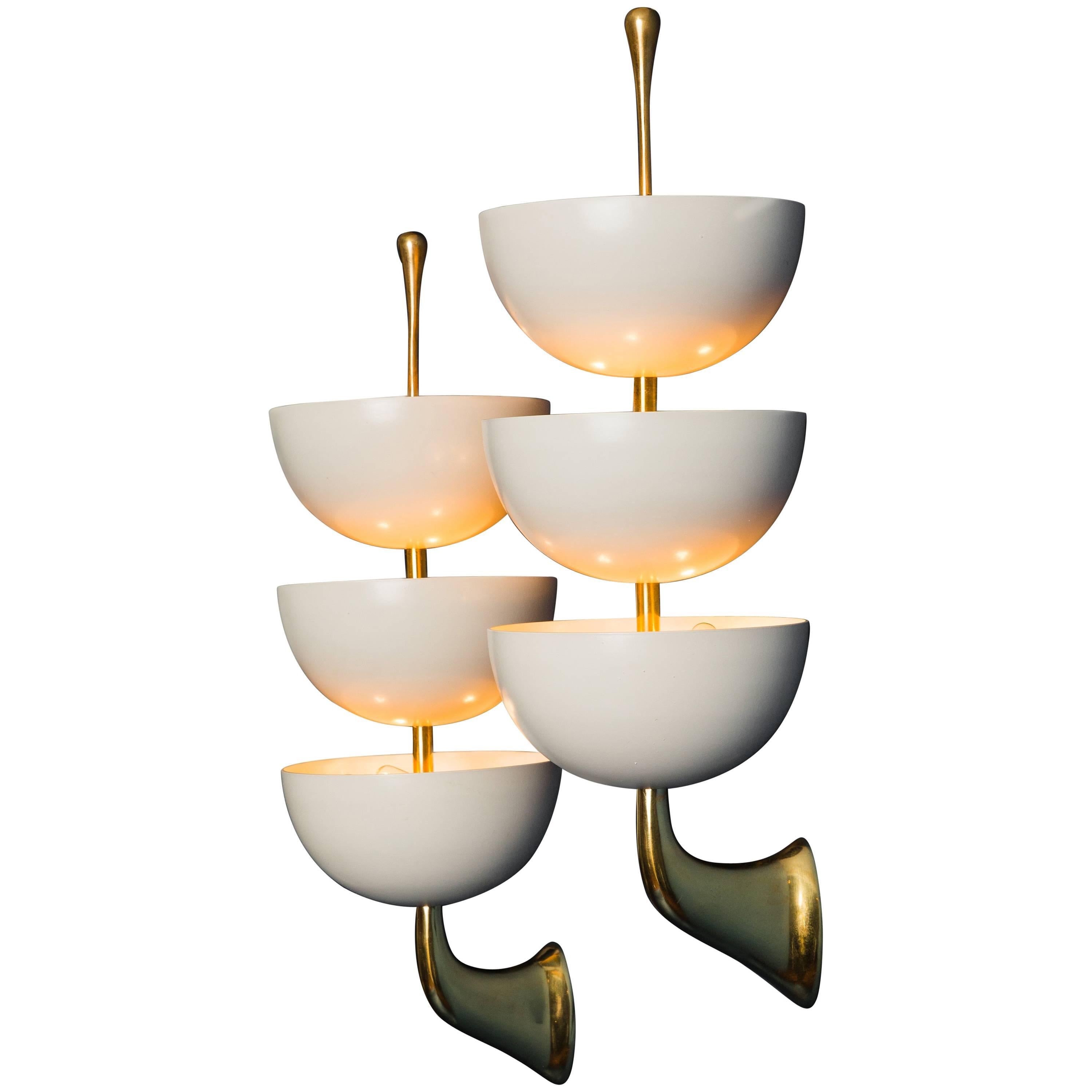 Stilnovo rare original pair of sconces with three eggshell white lacquered metal cups mounted on gilt lacquered brass structure, Italy, circa 1952. Stamped 'STILNOVO' on finials. 
Rewired to U.S. standards.

Literature:
Charlotte & Peter Fiell,