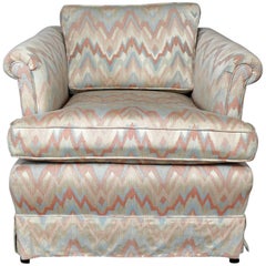 Tuxedo Style Skirted Lounge Chair with Rolled Arms and Flame Stitch Upholstery