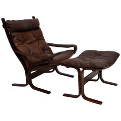 Retro Leather Siesta Armchair and Stool by Ingmar Relling