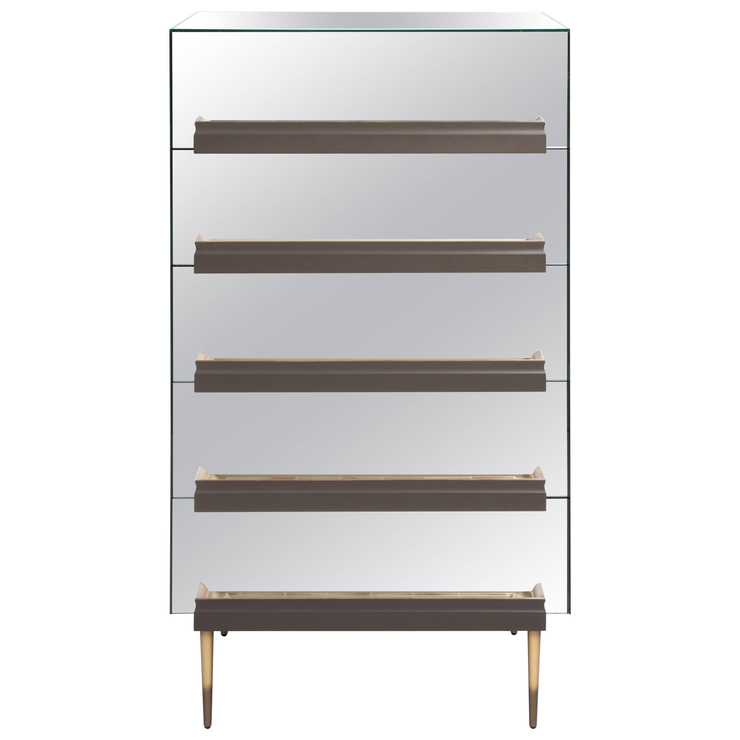 Part of the illusion collection, this dresser uses mirrors to reveal the beauty of picture frame moldings while creating the illusion of floating trays or open drawers. 

Born and raised in Caracas, Venezuela, Luis Pons is an award-winning designer