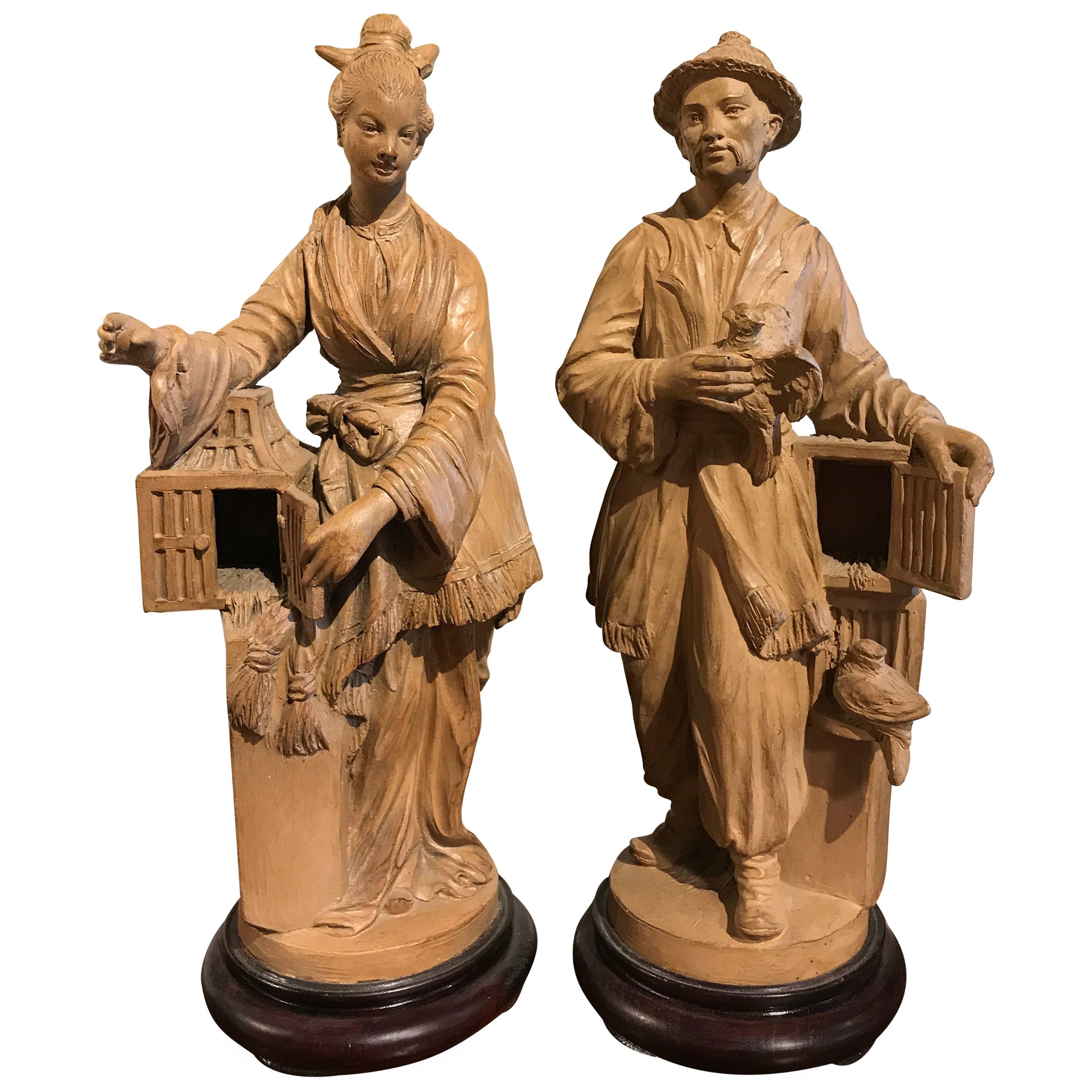 Pair of French Chinoiserie Terracotta Figures of Bird Sellers