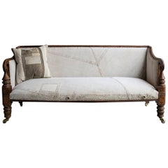 Late Regency Carved Mahogany Campaign Sofa