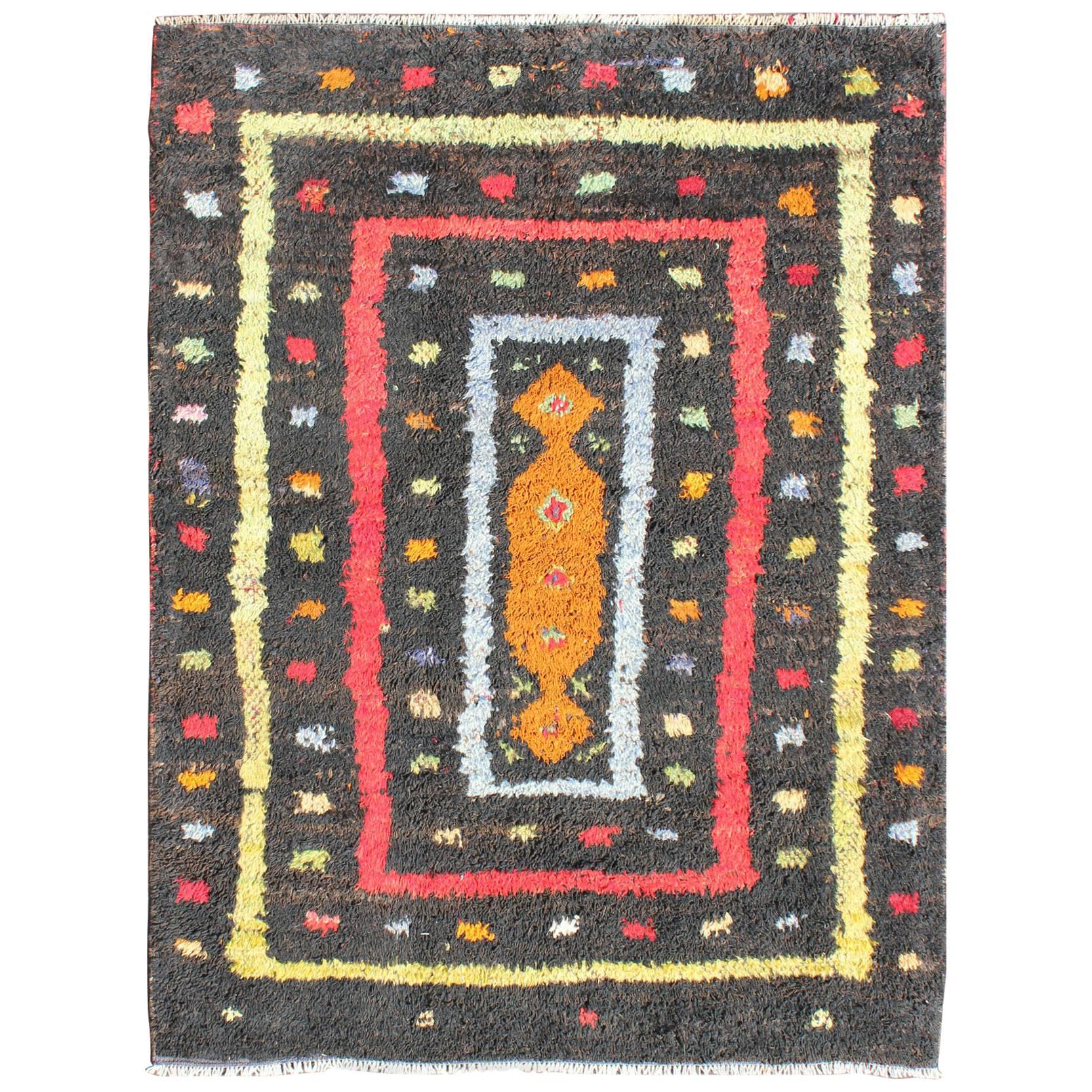Vintage Turkish Tulu Rug with Tribal Pattern in Black, Yellow, Red, Blue and Red For Sale