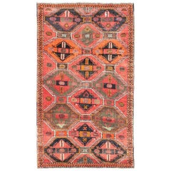 Geometrischer Oushak-Teppich im Vintage-Stil mit Medaillons in Rot, Orange, Anthrazit und Braun, Stammeskunst