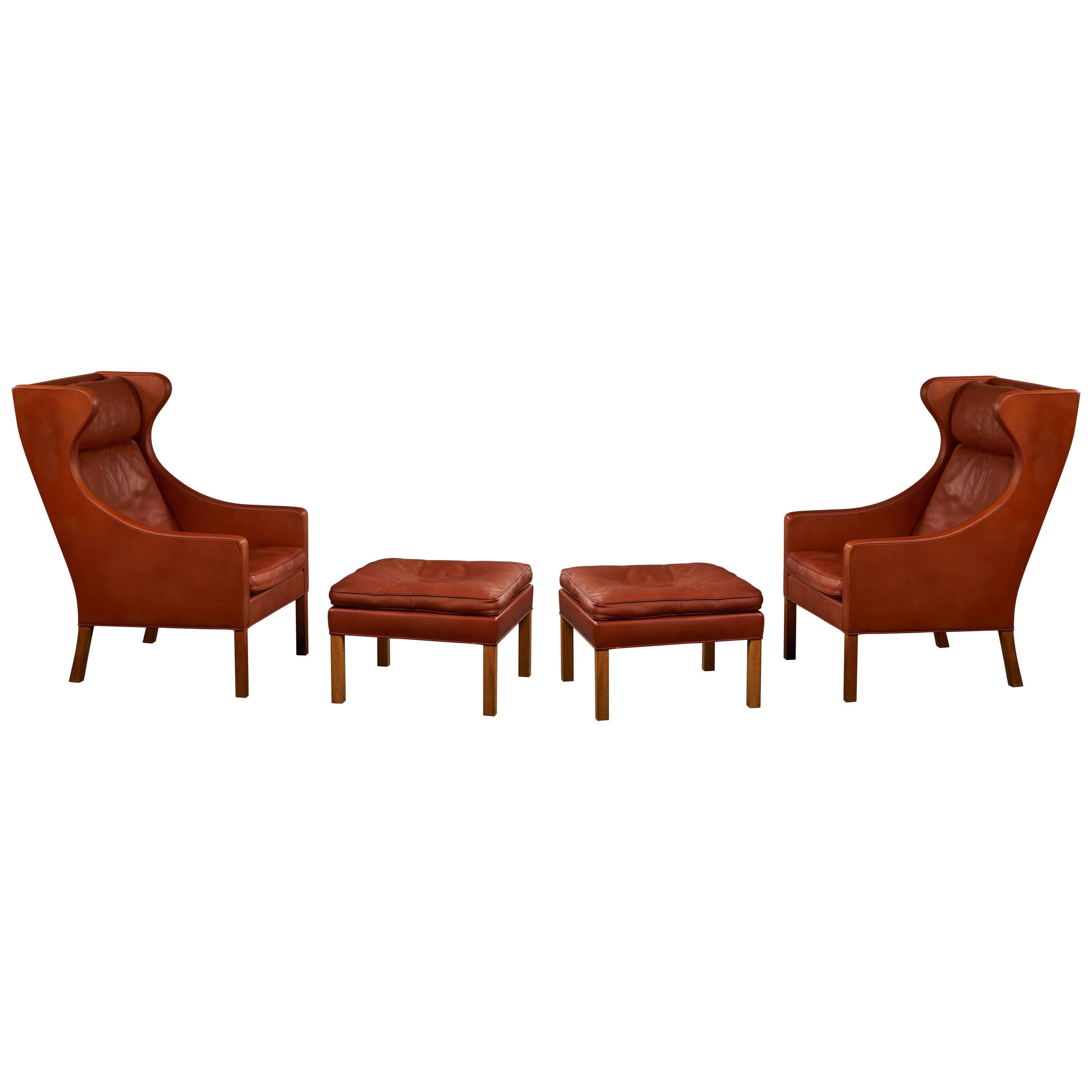 Pair of Børge Mogensen Wing Chairs with Ottomans For Sale
