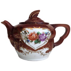 Plum Red-Ground Saltglaze Stoneware Teapot and Cover, circa 1940