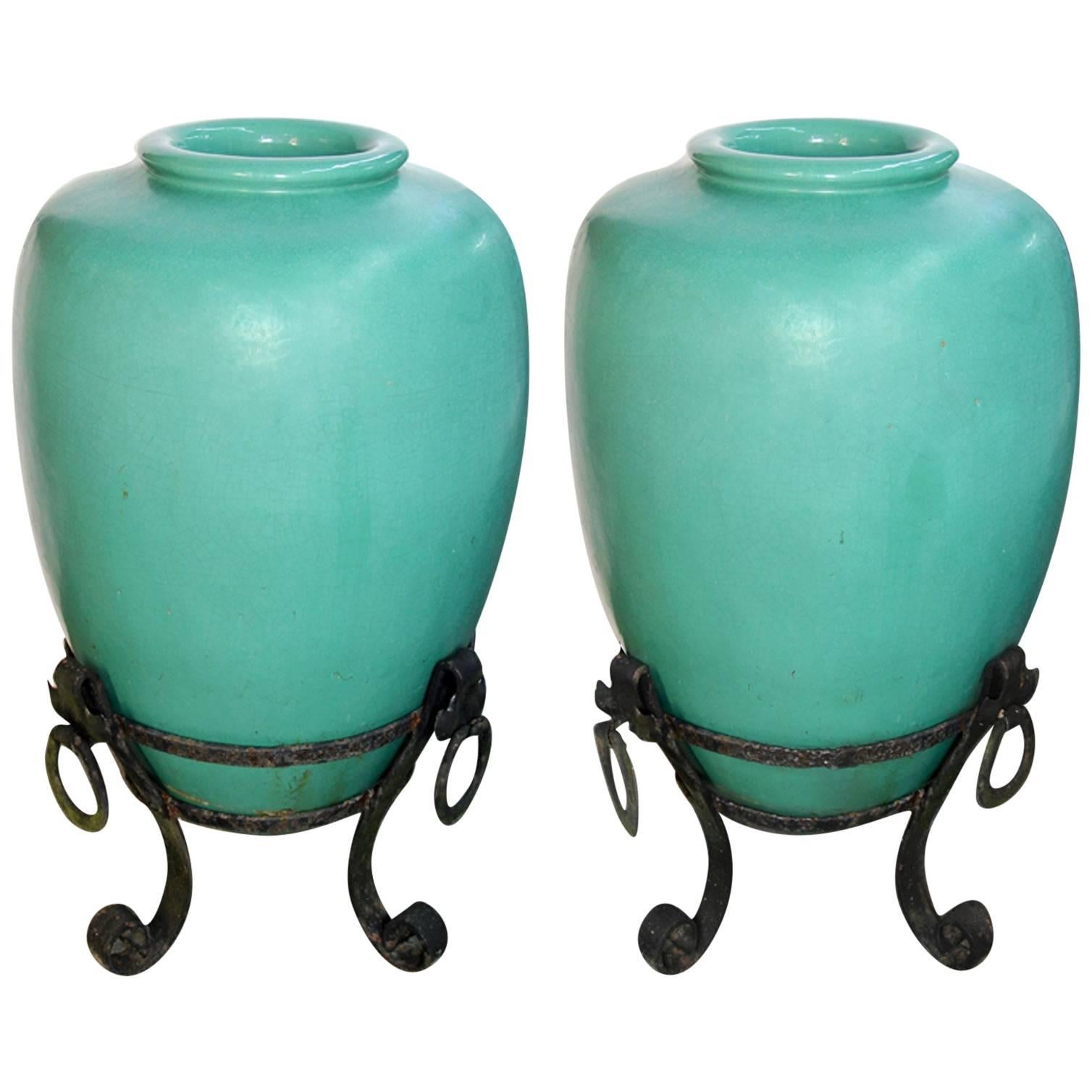 Large Pair of Pottery Urns on Wrought Iron Stands For Sale