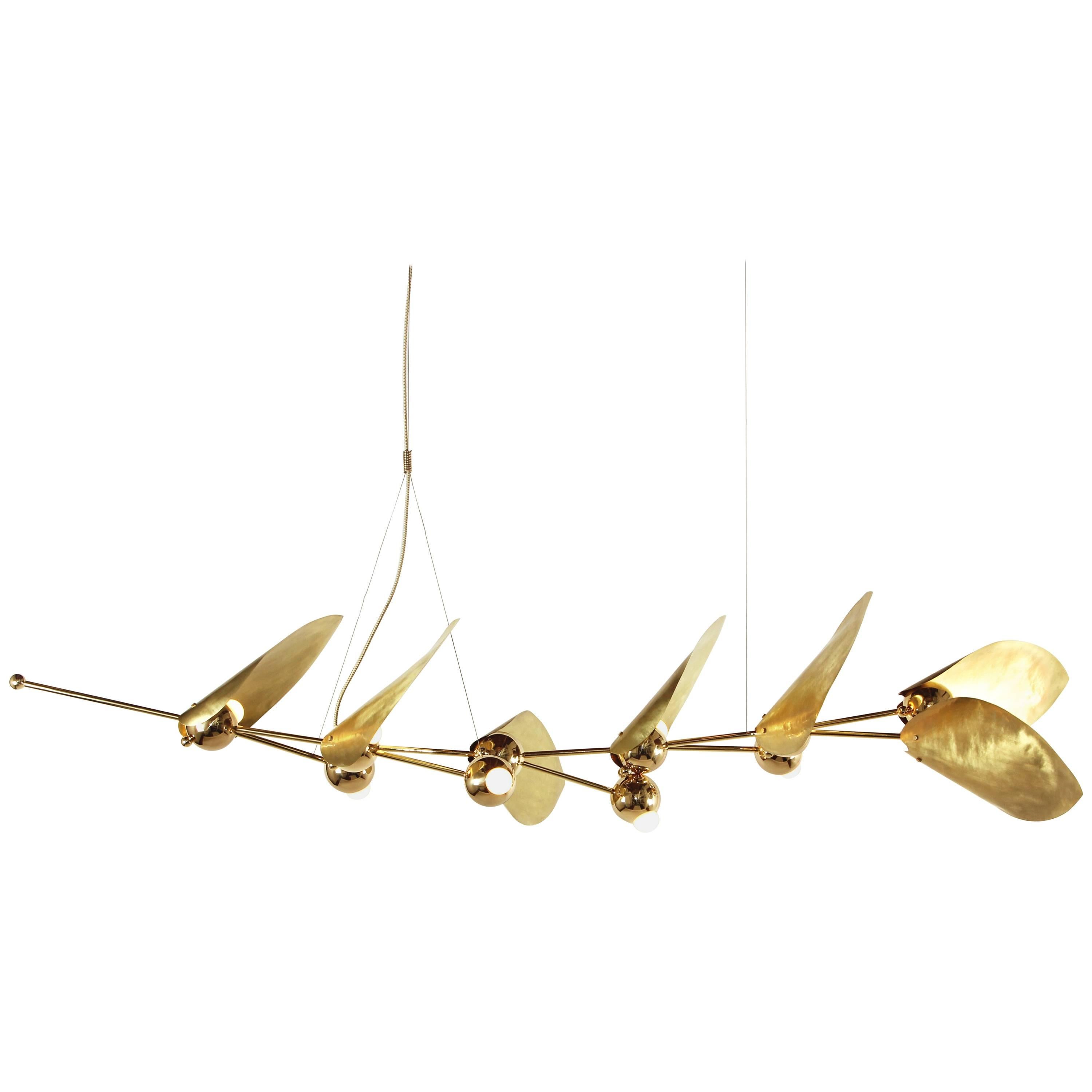 Inspired by laurel wreaths from ancient Rome, this chandelier is comprised of hand-hammered brass leaves surrounding integrated LED bulbs. The design features a natural spiral twist, creating greater movement and form.

Each piece is made to order.
