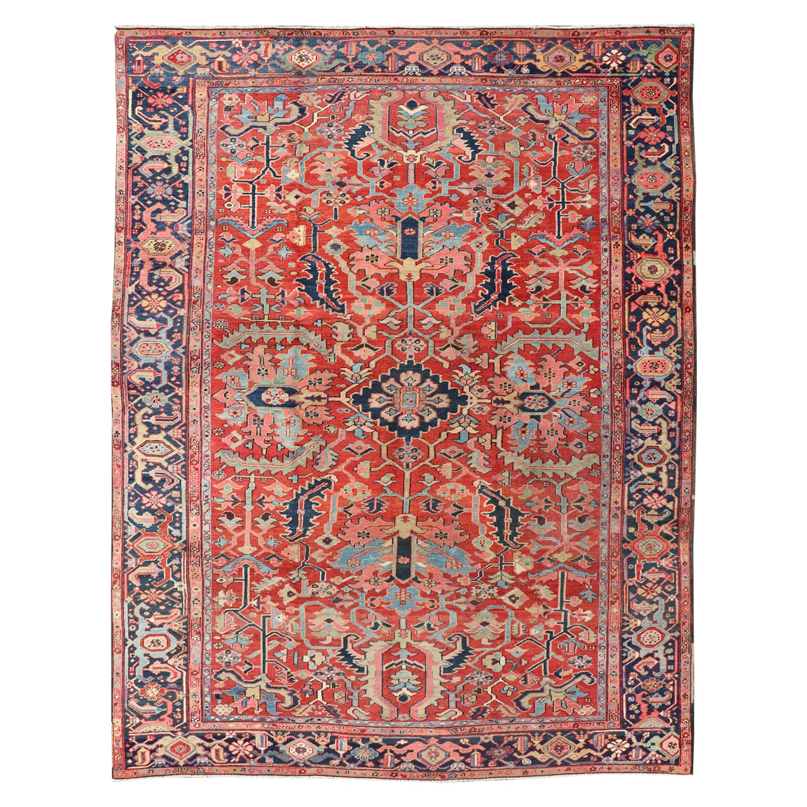 Antique Persian Medallion Serapi Rug With Red Background and Blue Border For Sale