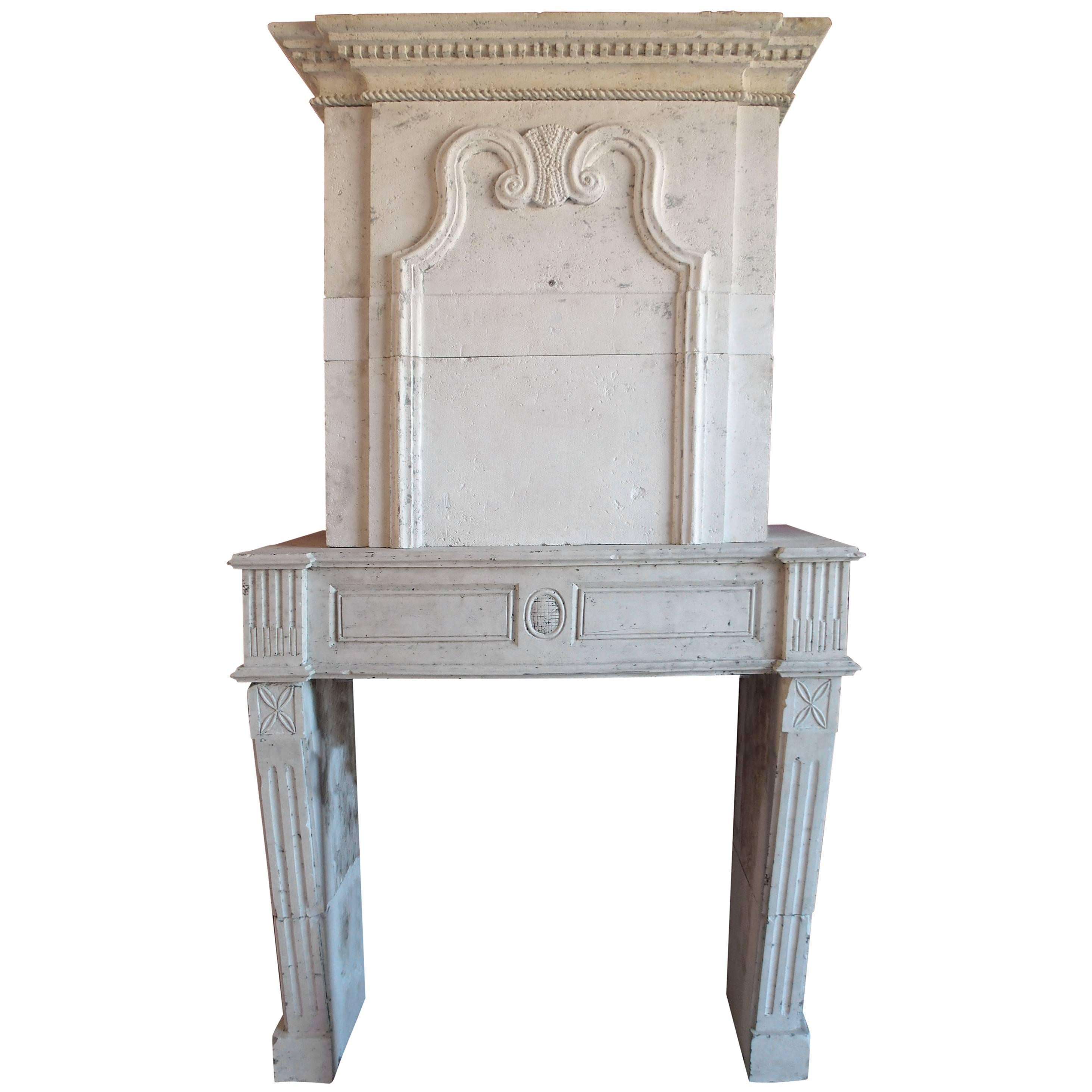 18th Century Louis XVI Stone Fireplace with Trumeau and Geometric Design, France For Sale