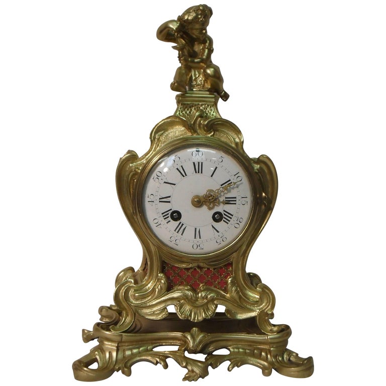 19th Century French GoldPlated Mantel Clock with Carved Wooden Gold
