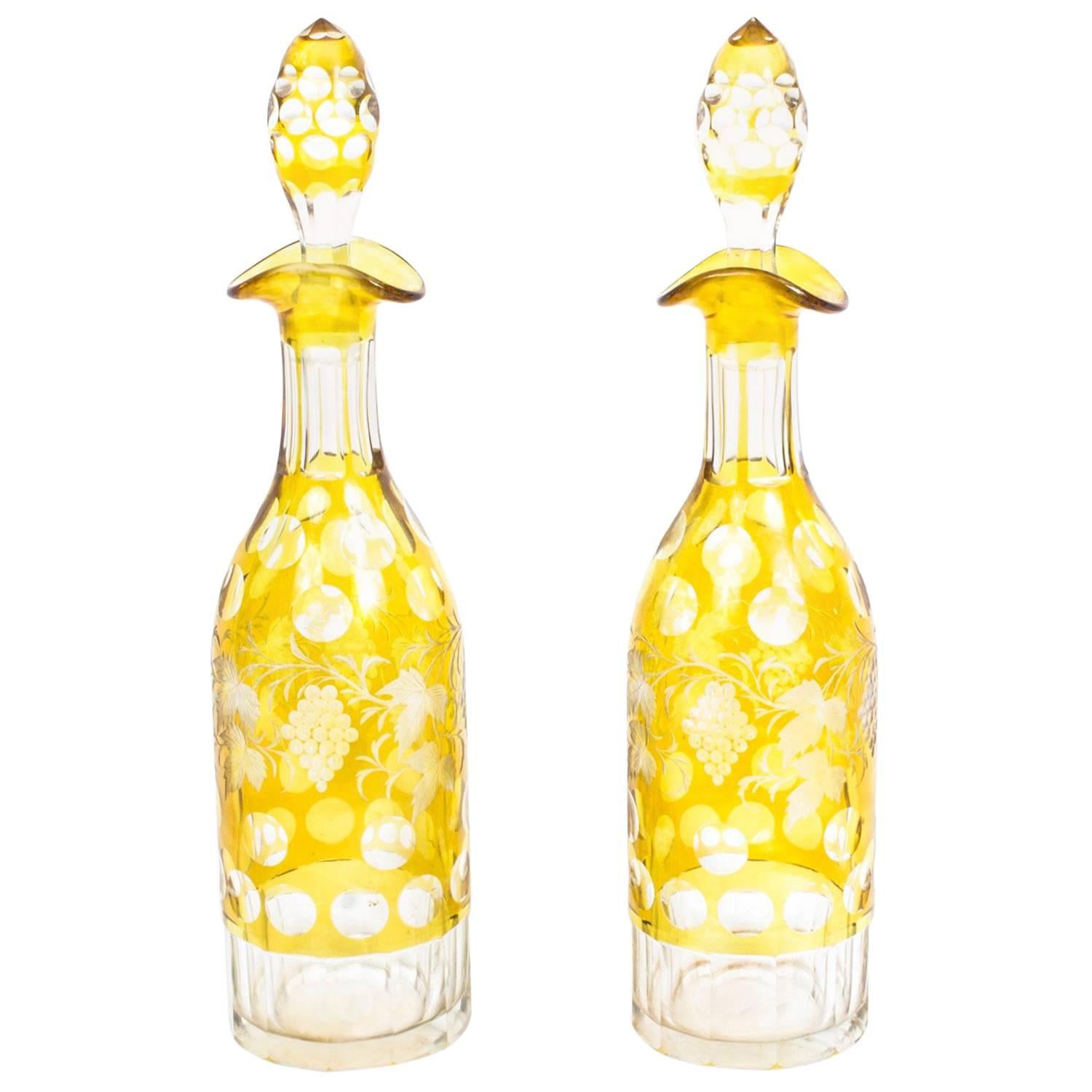 Early 20th Century Pair of Cut-Glass Amber Engraved Decanters