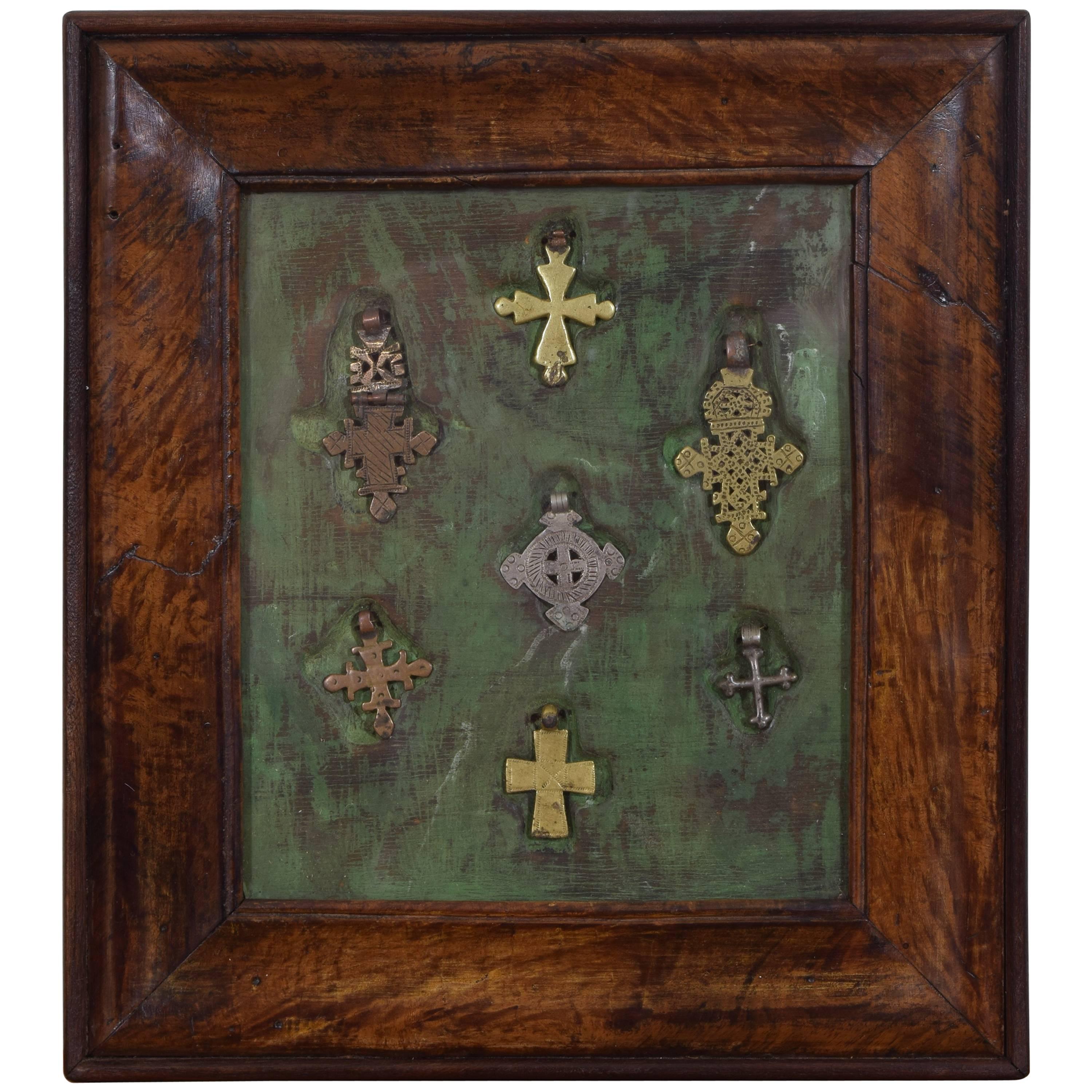 Walnut Framed Collection of Bronze and Silvered Crosses, 19th Century or Earlier