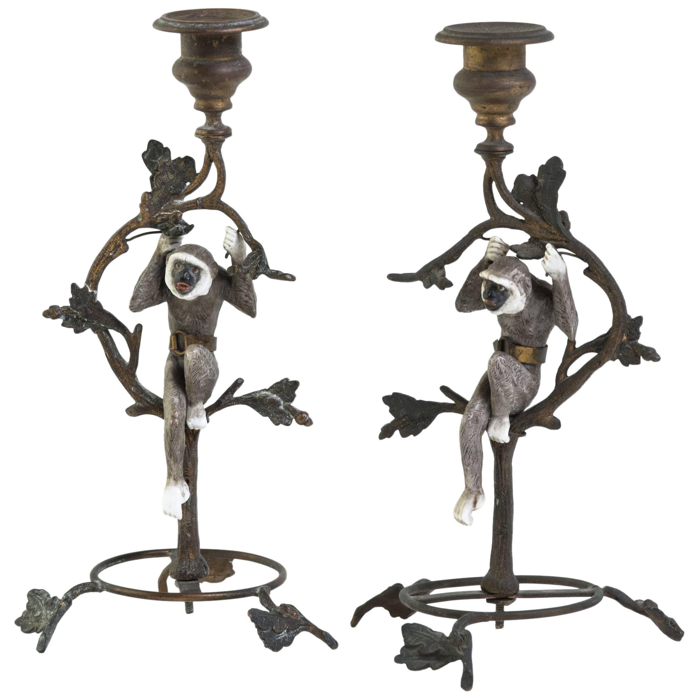 Pair of French Turn of the Century Brass and Porcelain Monkey Candlesticks For Sale