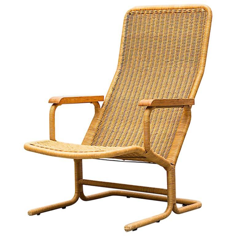 Dirk Van Sliedregt Rattan Lounge Chair with Wood Arms