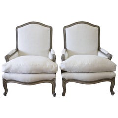 Antique Pair of 20th Century Louis XV Style Painted and Upholstered Linen Bergere Chairs