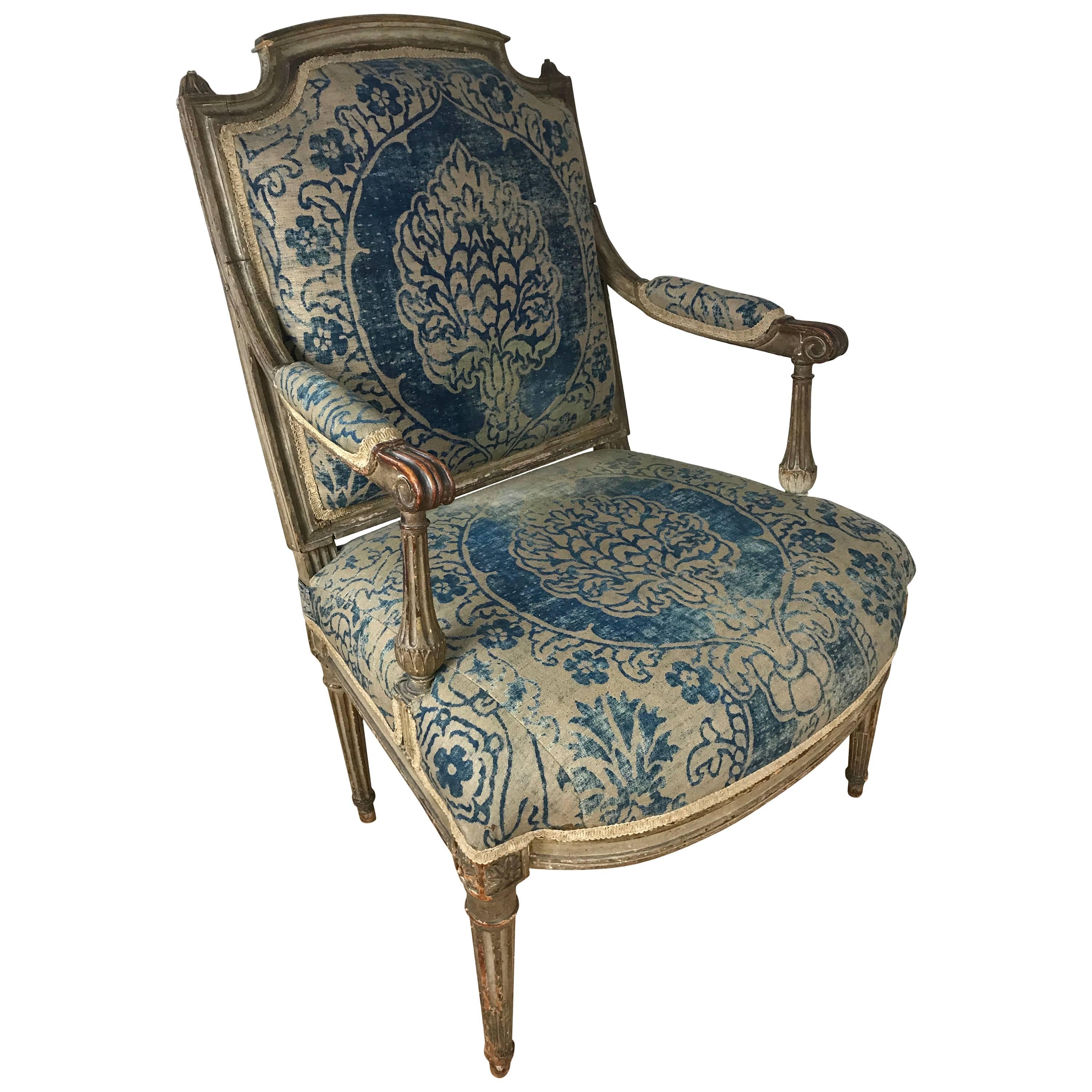 A lovely 18th century Louis XVI chair upholstered in original Fortuny fabric.