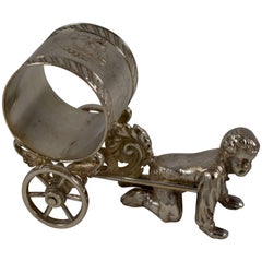 Silver Victorian Era Aesthetic Movement Figural Napkin Ring, Boy Pulling a Cart