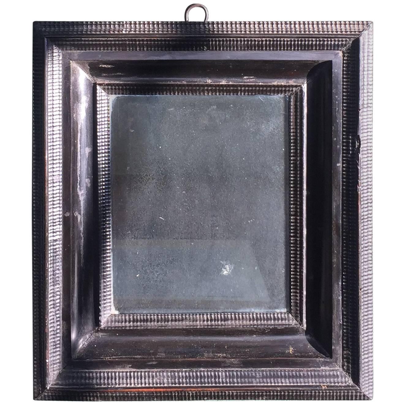 18th Century Flemish Ebonized Ripple Molded Cabinet Mirror