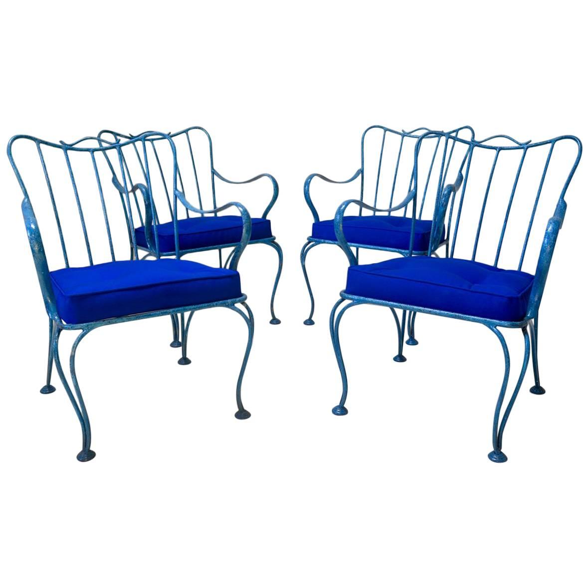Four French Mid-Century Iron Lounge Chairs