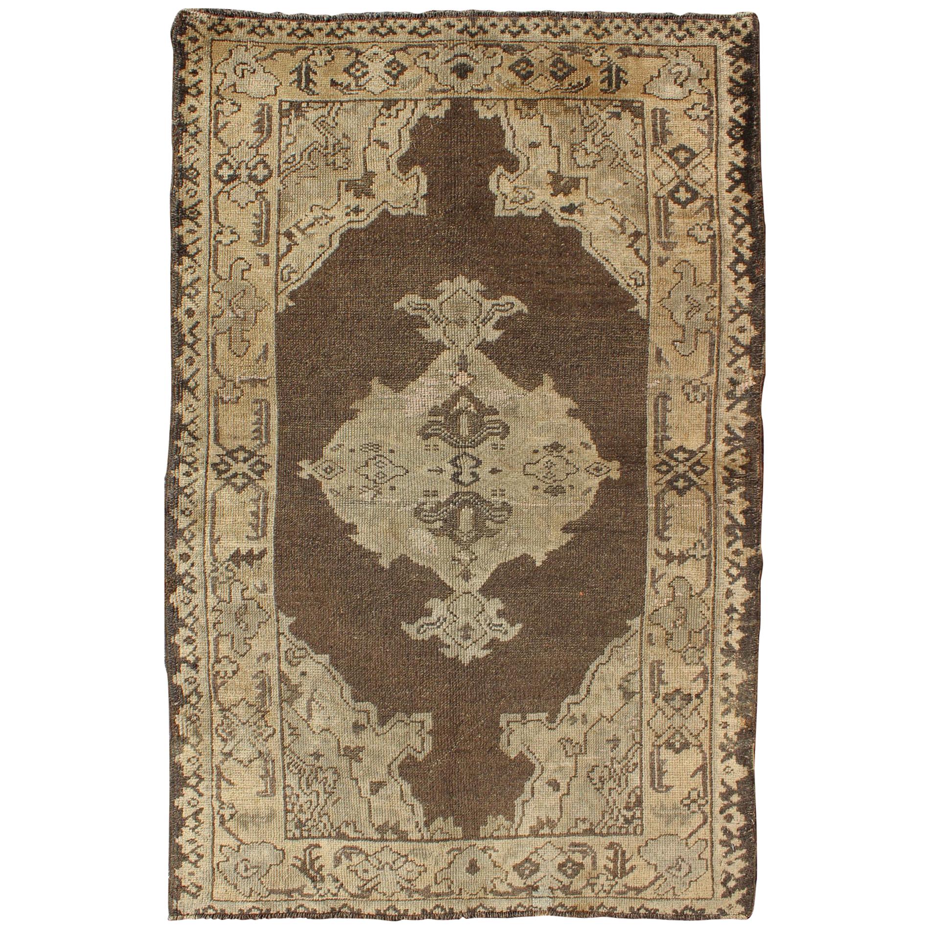 Chocolate Background Vintage Turkish Oushak Rug with Floral Medallion in Cream For Sale