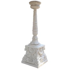 White hand carved Marble pedestals with tall torchiers for landscape lighting 