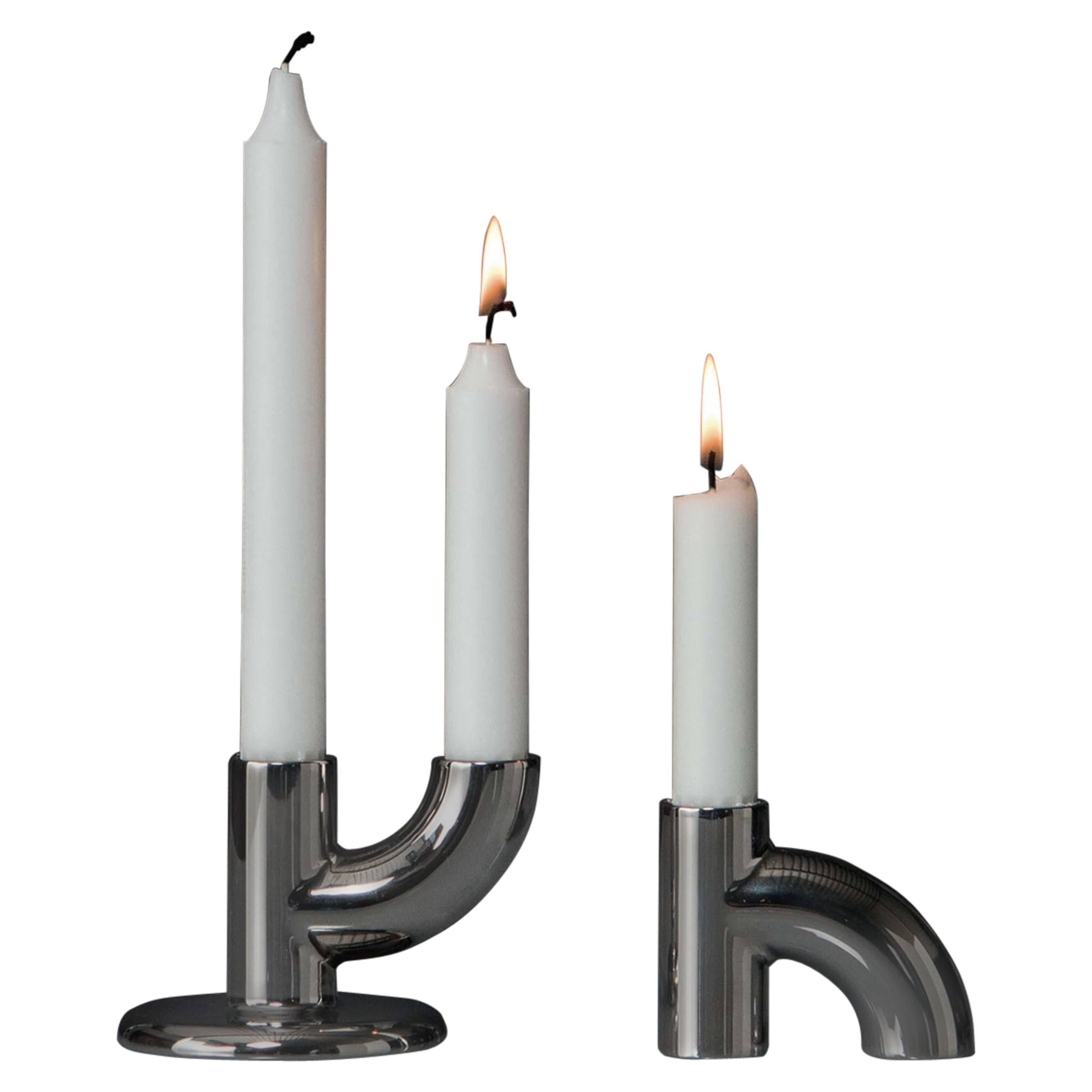 The Alia candleholder is modular and stackable. Designed into two basic forms, it allows users to transform and place the candleholder in various different ways. The body of the candleholder is cast in zinc alloy and the surface is chrome plating