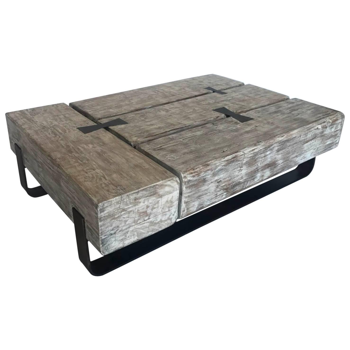 Reclaimed Beam Coffee Table with Iron Base by Dos Gallos Studio