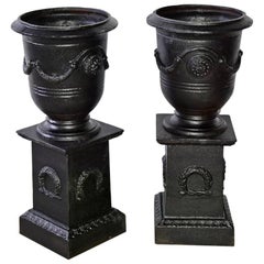 Pair of Retro Neoclassical Style Urns on Pedestals