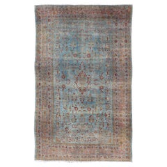Blue Background Antique Persian Mohajerah Rug with Salmon, Blue, Green, and Red