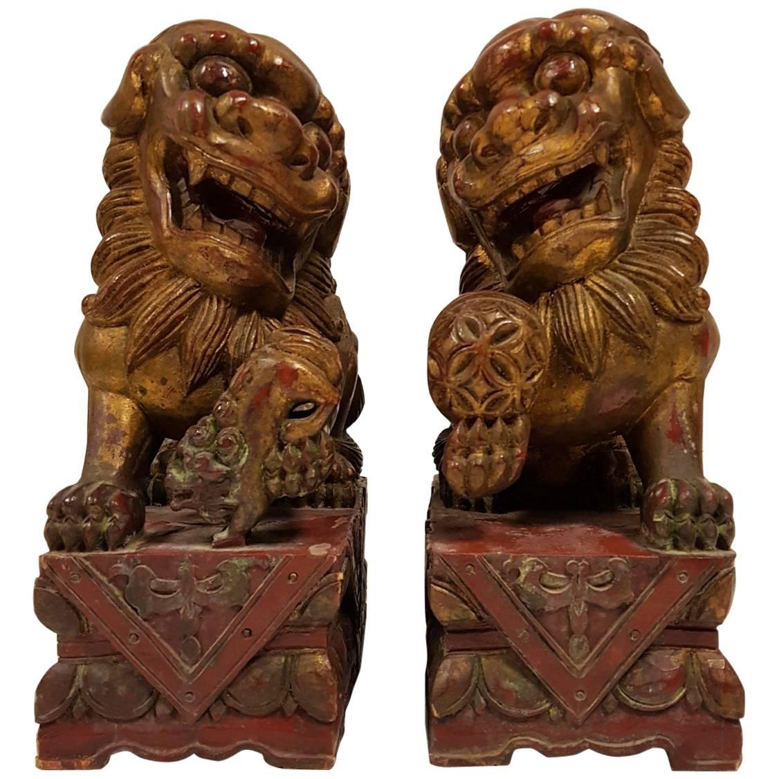 Pair of 19th Century Carved Wood Lacquered and Gilt Chinese Foo Dog Figures For Sale