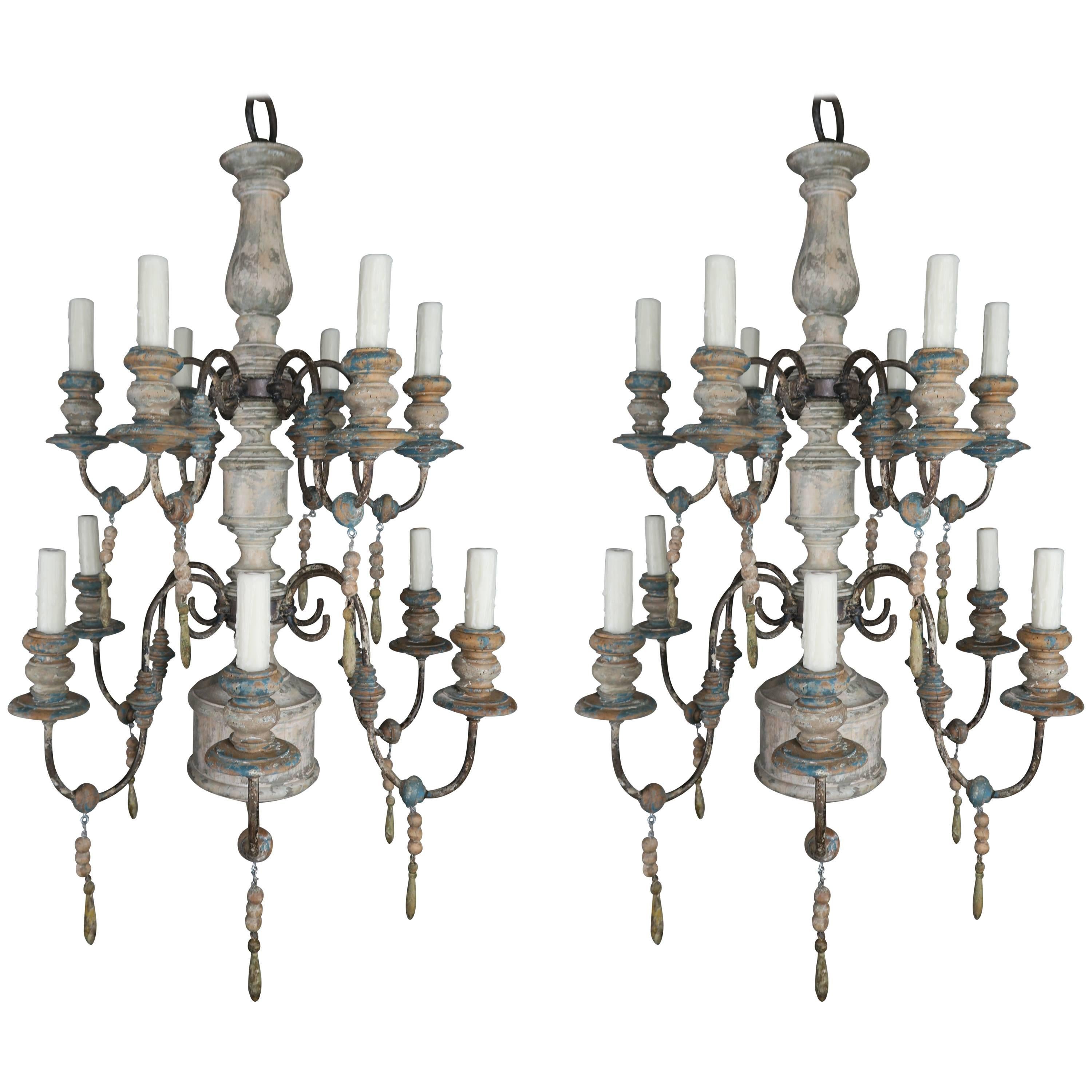 Pair of Twelve-Light Wood and Iron Painted Chandeliers
