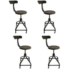 Four French Industrial Adjustable Stools