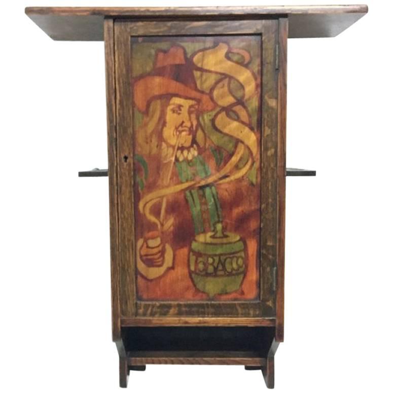 Liberty & Co. an Oak Smokers Wall Cabinet with a Gentleman Smoking a Pipe