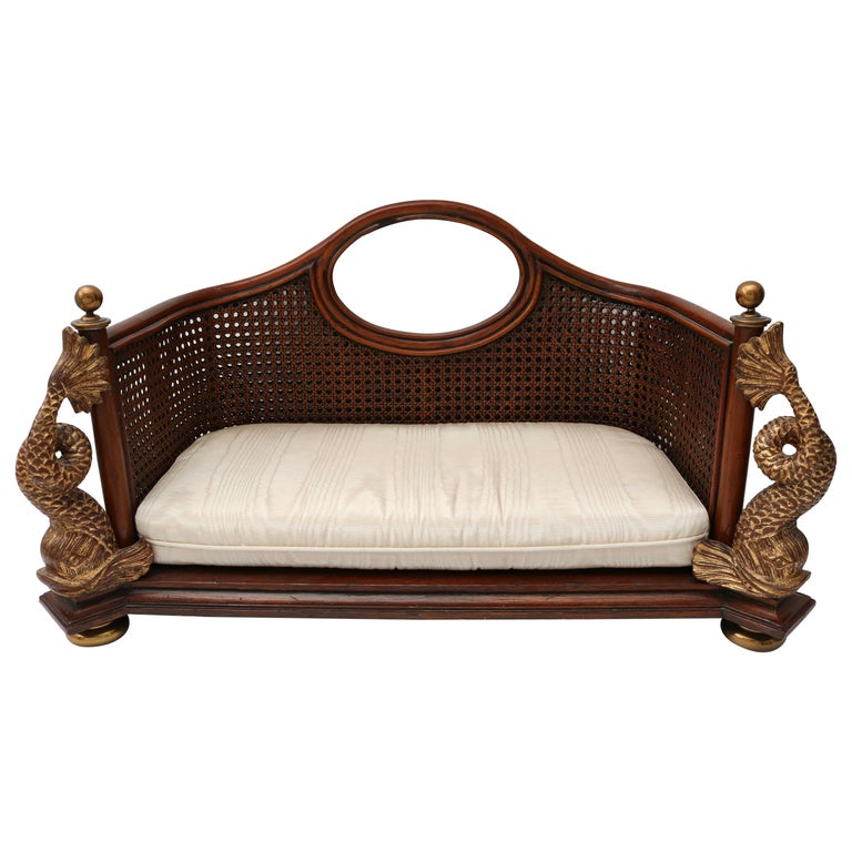 Rattan dog bed with decorative brass coy fish